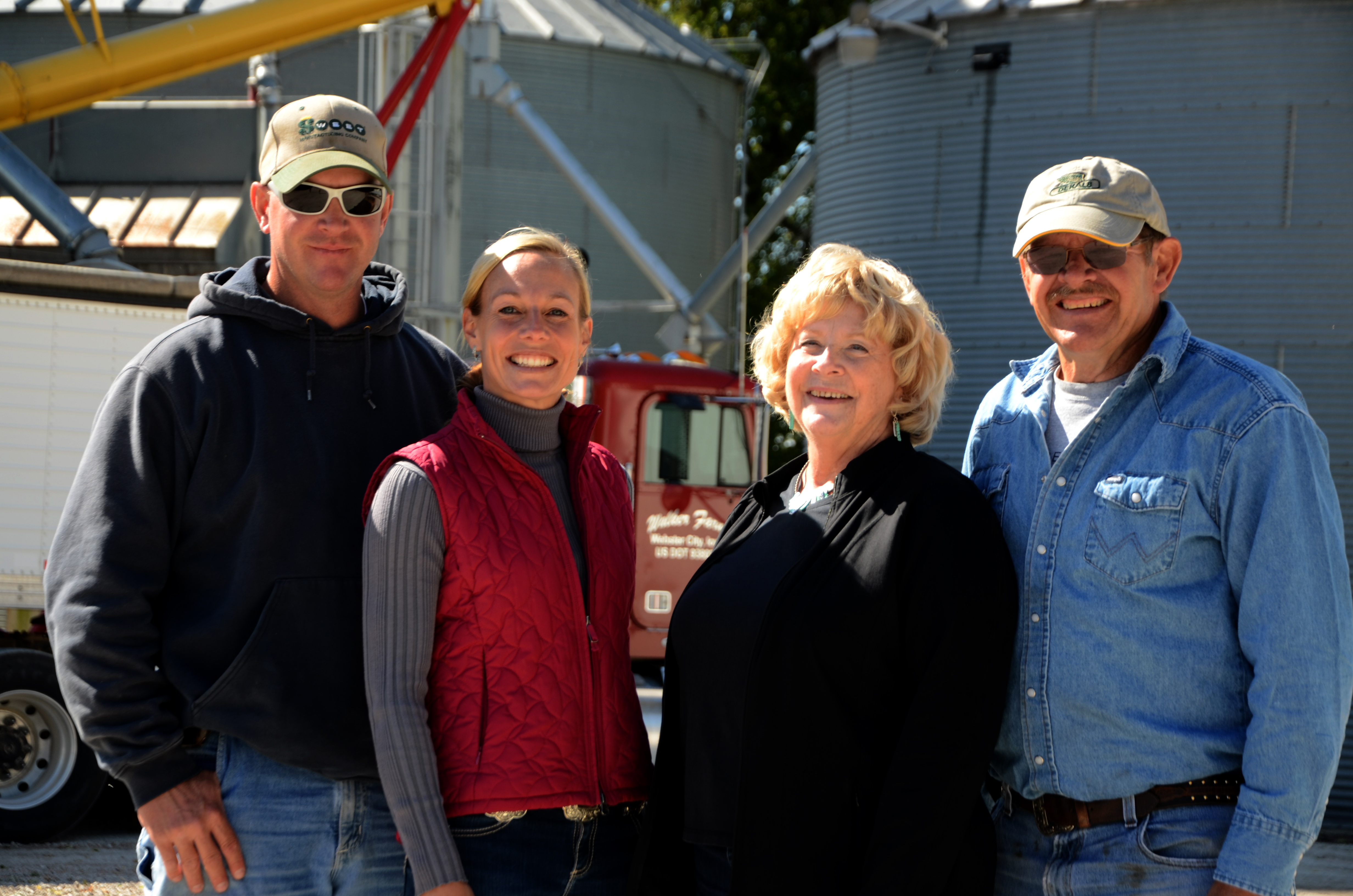 Kris and Patty Walker with their husbands on their farm near Webster City, Iowa.